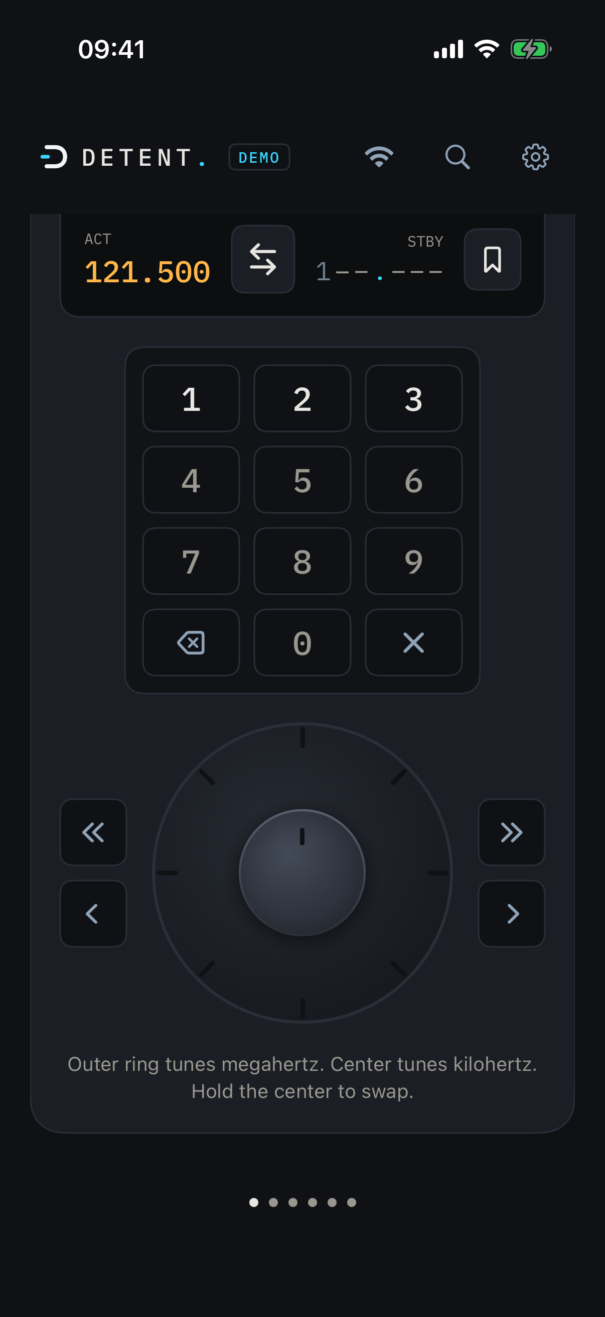 DETENT keypad entry part way through typing a frequency, with the tuning caption fully visible above the page dots